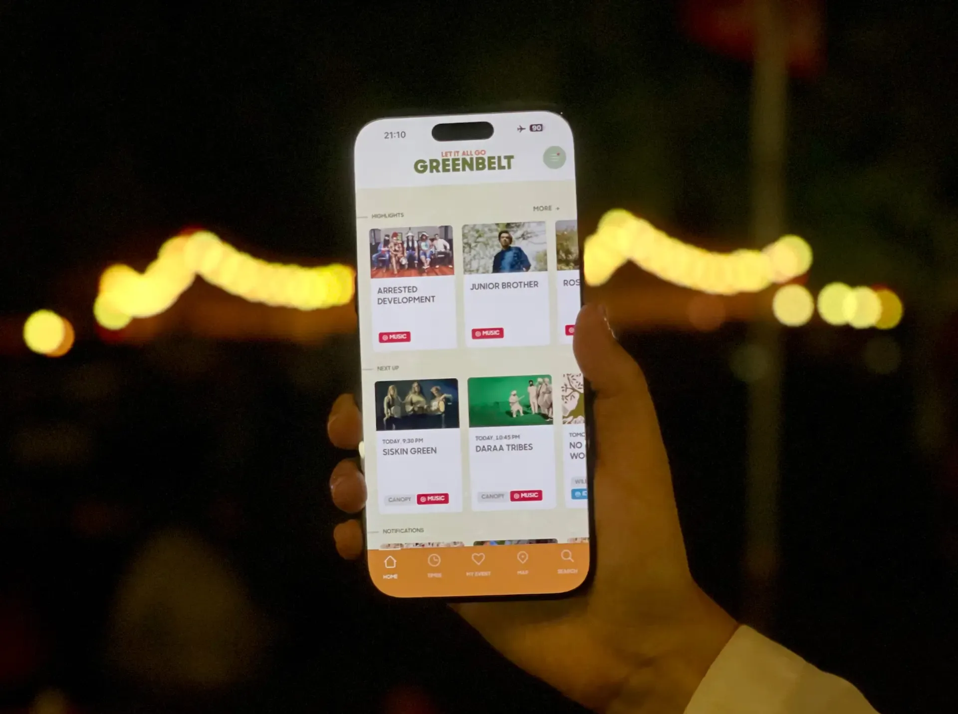A festival attendee using the Greenbelt Festival app